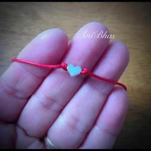 3 heart bracelets and 1 evil Eye